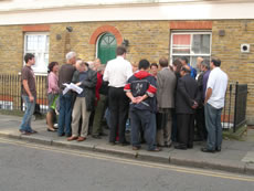 Discussions in front of 107-111 Churchfield Road