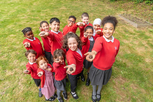 The children of East Acton Primary with their seed bombs 