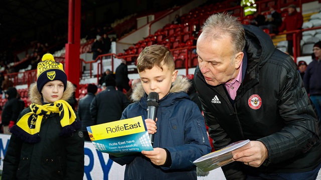 Reading out the team sheet against Oxford United aided b y Peter Gilham