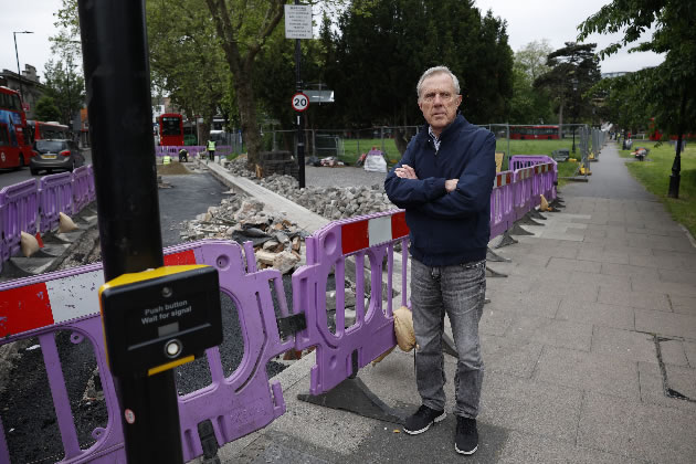 Peter King by unfinished work near Ealing Broadway station