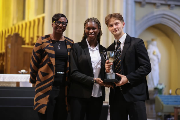 Donna Fraser OBE, with two St Benedict's prize winners