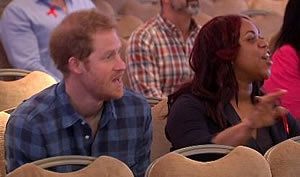 Prince Harry enjoys music by Joyful Noise choir