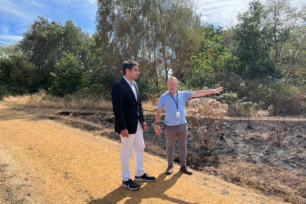 Cllr Salman Shaheen, inspects the damage at Hanworth Park with Jim Buchan from GreenSpace 360