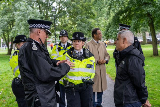 Sir Mark Rowley and Sadiq Khan talk to officers on Haven Green 
