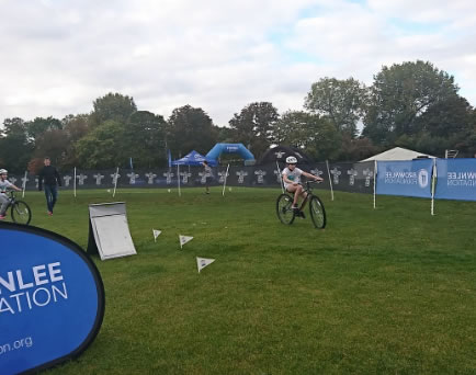 boy cycles around course at Brownlee triathlon