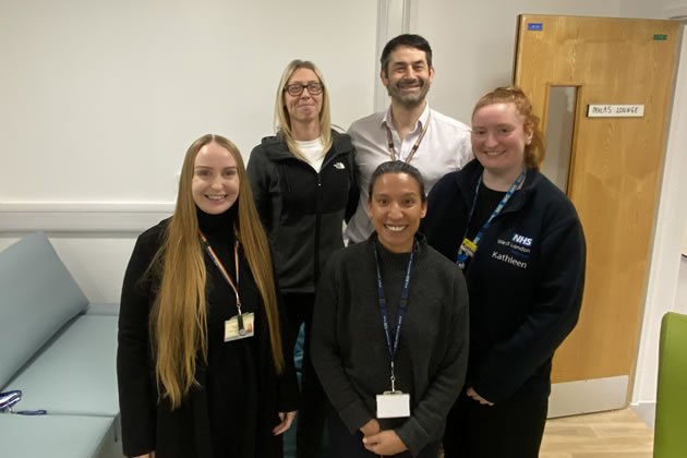 Dr Nick Hipkins with staff at the service